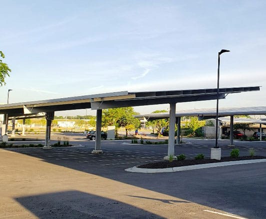 Solar carports in a parking lot of a medical building